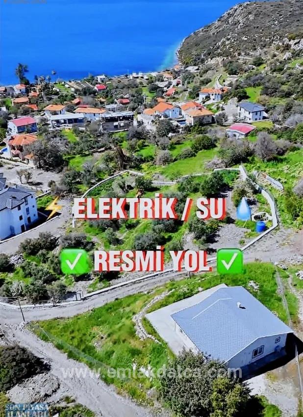 Söğüt köyünde Simi adası ve deniz manzaralı ekolojik turizm İmarlı 2100 m2 tarla