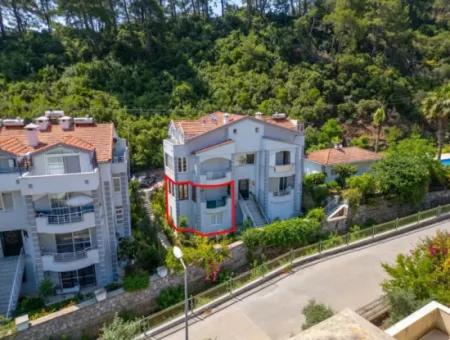 Marmaris İlçesi Beldibi Mahallesi Doğa Manzaralı Yüzme Havuzlu Site İçerisinde 3+1 Bahçe Dubleks Satılık Daire