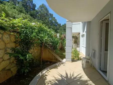 Marmaris İlçesi Beldibi Mahallesi Doğa Manzaralı Yüzme Havuzlu Site İçerisinde 3+1 Bahçe Dubleks Satılık Daire